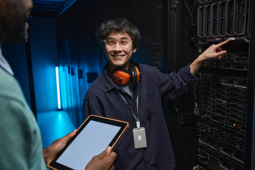 Smiling Server Engineer in Data Center AV and Security System Support